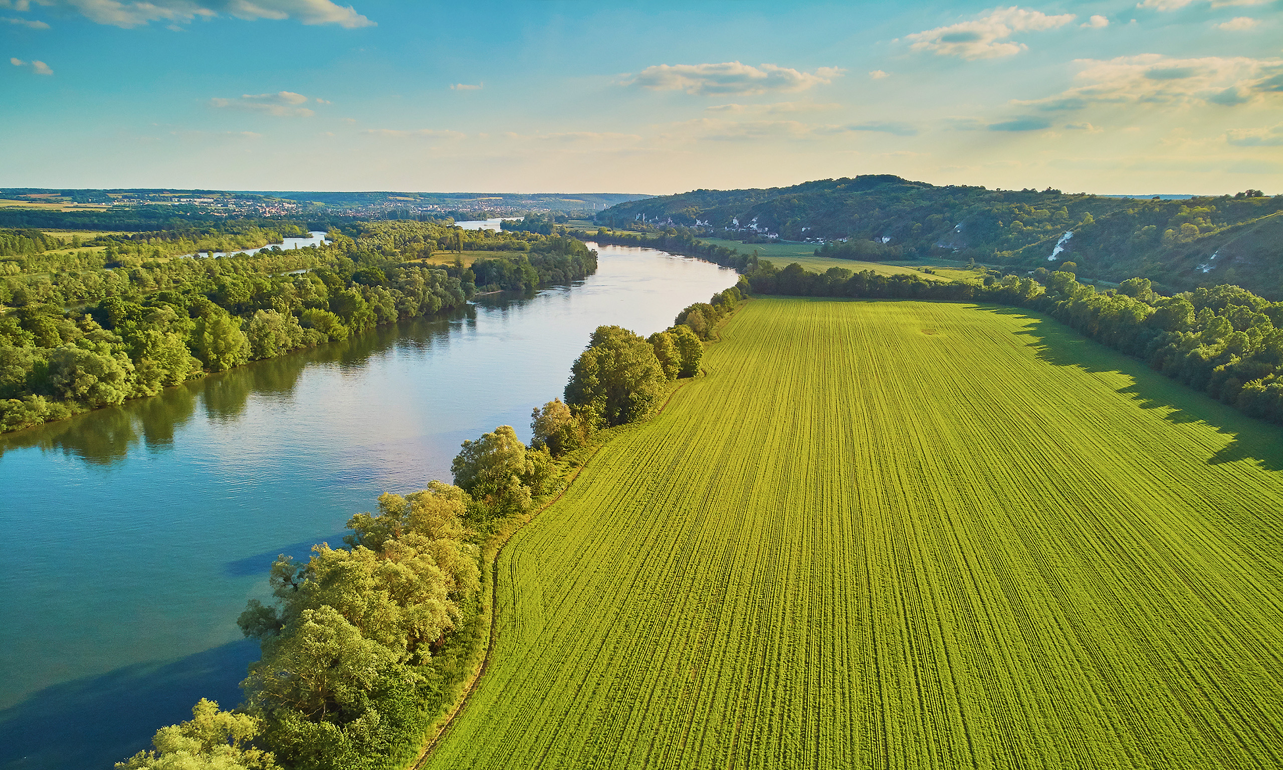 River and fields representing Sagentia Regulatory's environmental fate and exposure services