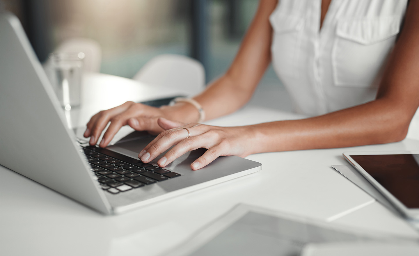 Typing into a computer representing Sagentia Regulatory's Biological Dossier Services