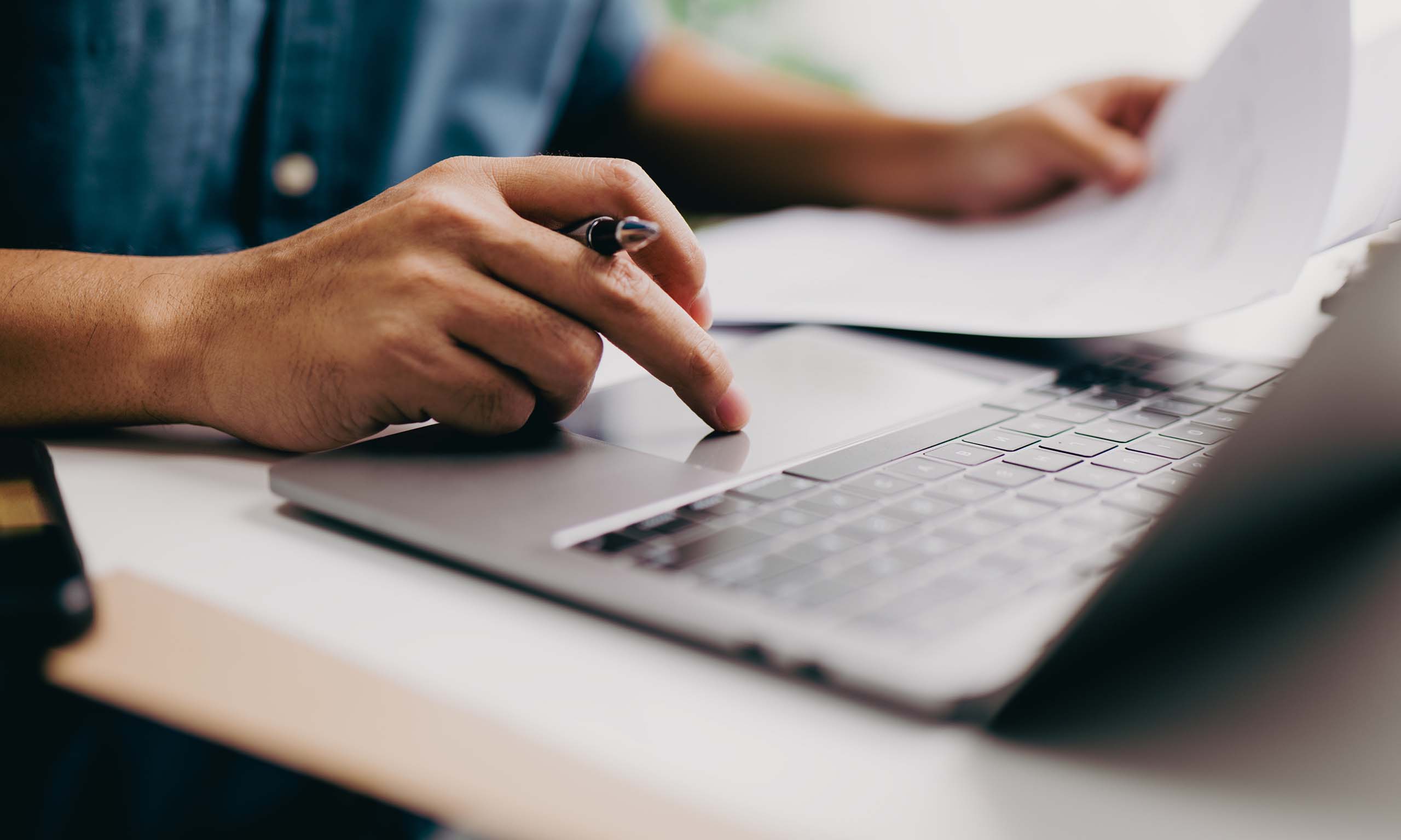 Man completing a Confidential Statement of Formula form representing Sagentia Regulatory's pesticide registration services