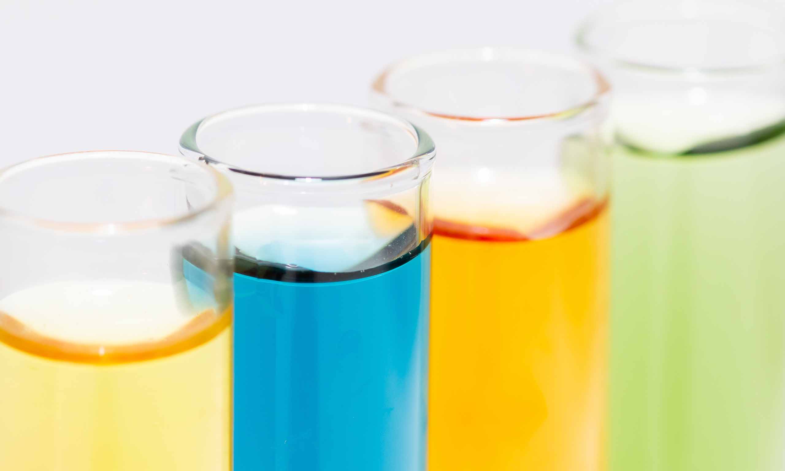 Test tubes containing coloured liquids representing Confidential Statement of Formula for pesticides | Sagentia Regulatory