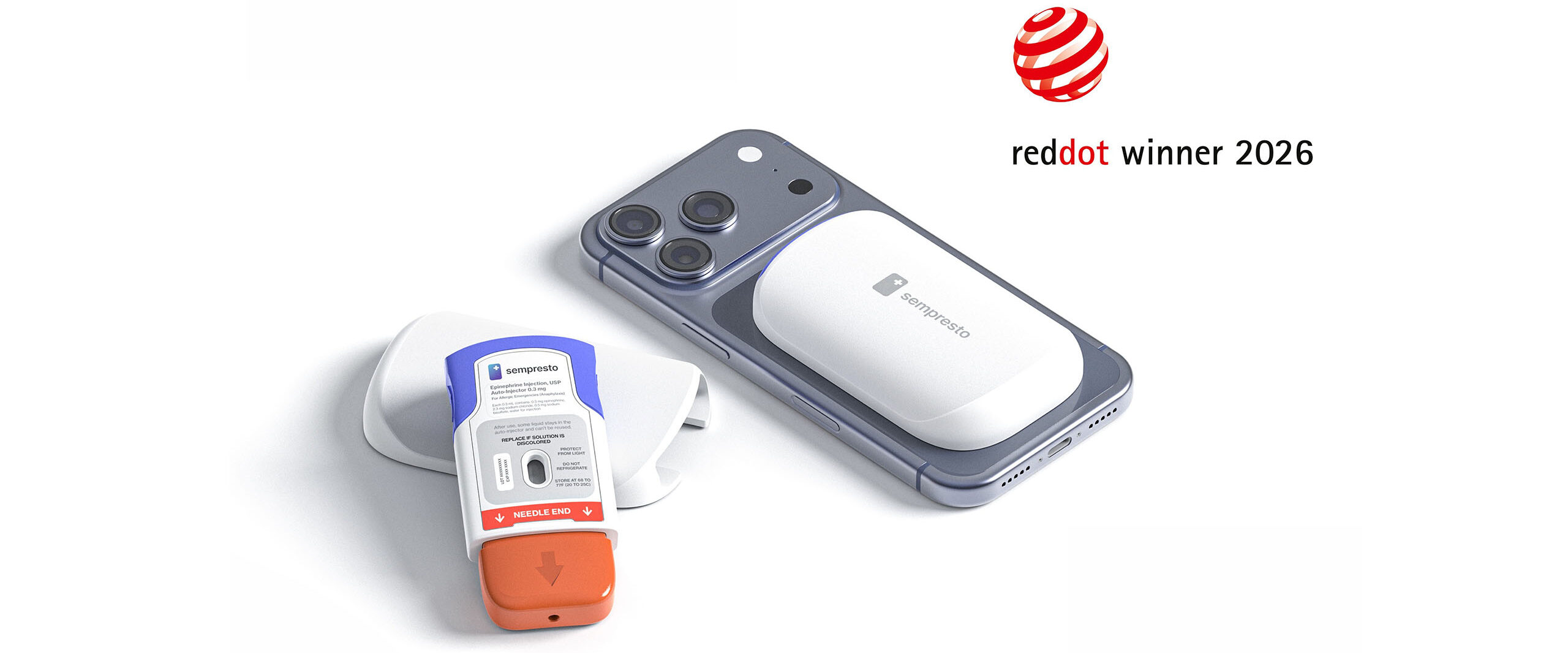 Smartphone with a white medical patch on its back and an orange epinephrine auto-injector nearby; 'red dot winner 2026' logo in the top-right corner.